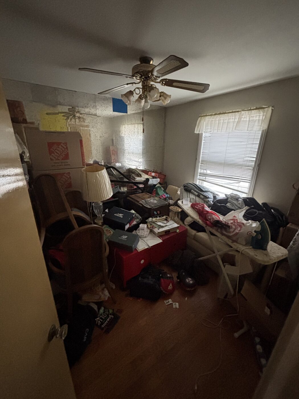 Cluttered room before a full home cleanout